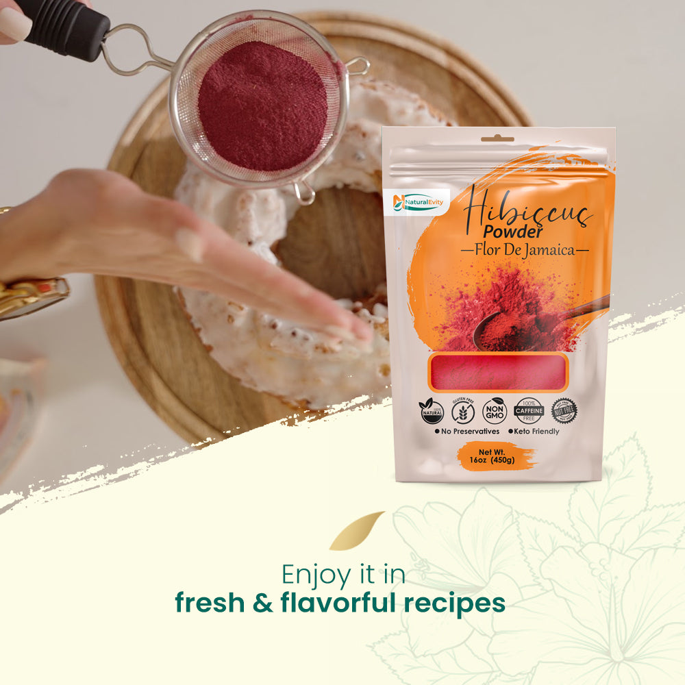 Hibiscus powder being added to a dish with a package of Flor De Jamaica Hibiscus Powder in the foreground, perfect for cooking or tea.